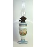 An early 20th Century opaque glass paraffin lamp 
With detachable cover,