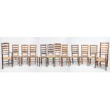A Harlequin matched set of twelve Ash and Elm ladder back dining chairs
With turned finials the
