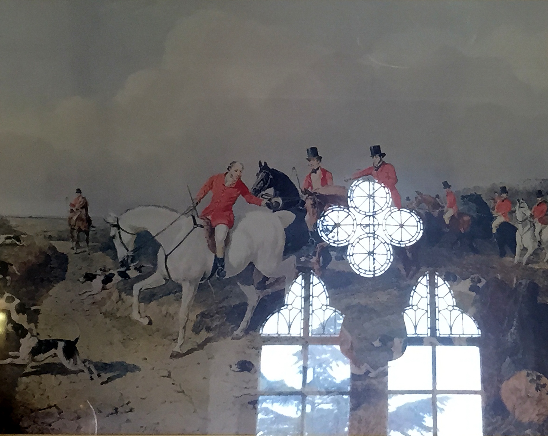 A pair of classical prints each depicting fox hunting scenes, each inset in ornate gilt frames.