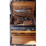 Two 20th Century tool chests containing a quantity of tools to include plains, saws, and drills.