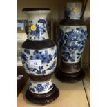 Two 20th Century Chinese blue and white crackle glazed vases on hardwood stands.