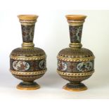 A pair of Mettlach German stoneware vases, of baluster form with cylindrical flared necks,