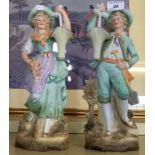 A pair of continental style bisque figures of gentleman and woman with hanging baskets (2).