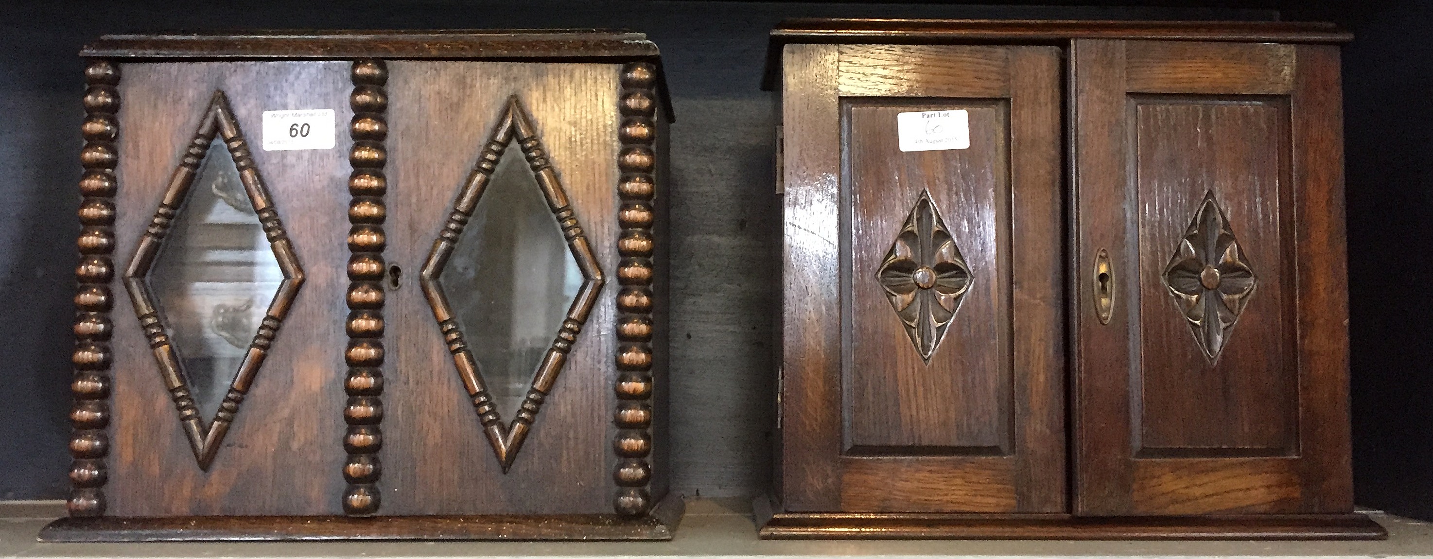 Two early 20th Century oak smokers cabinets.