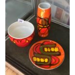 A group of three Poole Delphis Pottery ceramic items to include a vase,