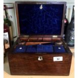 A Victorian rosewood ladies dressing table box the hinged cover lifts to enclose fitted compartments