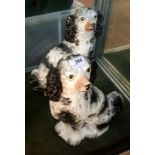 A pair of good 19th Century Staffordshire black and white spaniels (2).