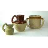 A collection of three Staffordshire stoneware jugs,