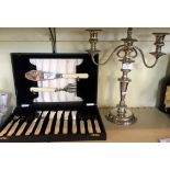 A modern silver-plated candelabra together with a silver-plated cased fish knives and fork set.