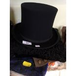 A mixed lot of assorted items to include a folding top hat, assorted gloves etc.