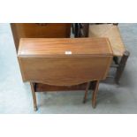 An Edwardian mahogany and cross  banded Sutherland table.