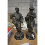 A Bronze patinated terracotta figure of a warrior on an integral circular plinth and a companion .