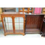 A Stag open bookcase and a modern mahogany 2 door display cabinet.