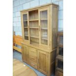 A Modern light oak dresser the high back with 2 glazed doors the base with an arrangement of 3