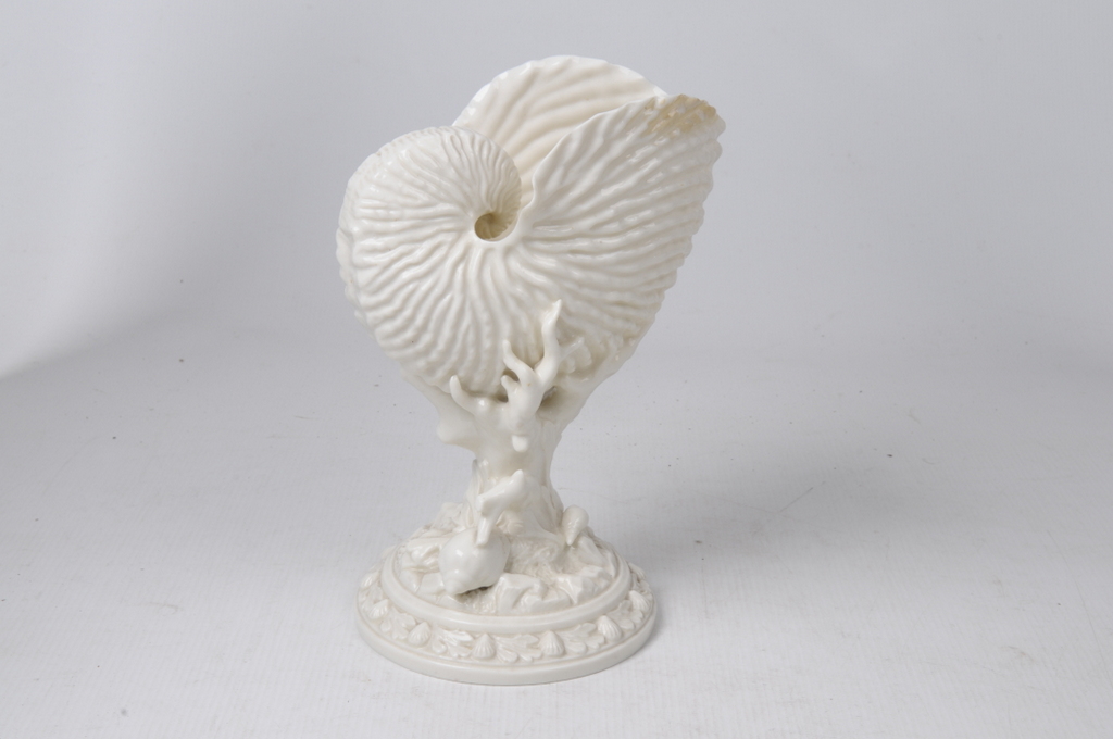 A Royal Worcester Nautilus shell vase, Circa 1880-90
The ivory glazed vase modelled as a large