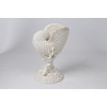 A Royal Worcester Nautilus shell vase, Circa 1880-90
The ivory glazed vase modelled as a large