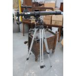 A Bushnell " Voyager " telescope and tripod.