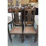 A Pair of early 20th century oak art nouveau side chairs the vase shaped splat backs mounted with