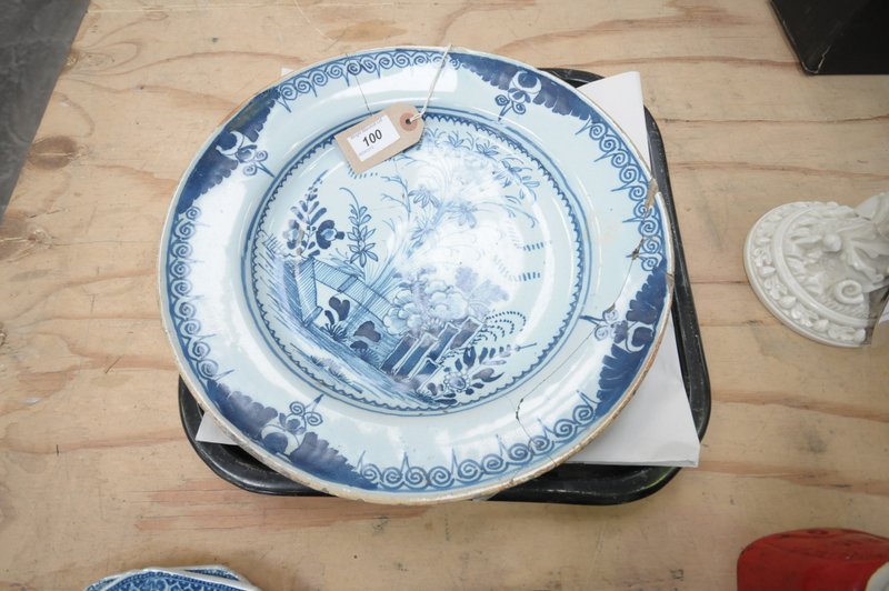 An English Delft blue and white plate
18th Century probably Bristol painted with a fence,