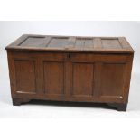 A 17th Century oak coffer
The rectangular hinged four panel top,