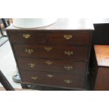 A 19th Century oak chest of 2 short and 3 long drawers, brass swan neck handles and bracket feet.