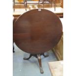 A 19th Century and later mahogany tripod table
With an 86cm diameter top raised upon a vase shape