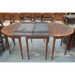 A 19th century mahogany and cross banded D end dining table with 2 extra leaves.