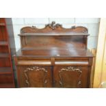 A 19th Century mahogany chiffonier with a  raised back centred with a leafy scroll crest above a