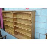 A Modern pine twin sectional open bookcase with 8 enclosed shelves ( approx.