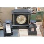 A Victorian black slate and marble clock garniture , with a white enamelled dial and Roman numerals.