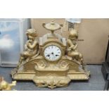 A 19th Century gilt spelter figural mantle clock
With a 8cm white enamel dial with Roman numerals,