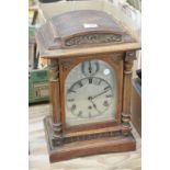 A Victorian oak cased bracket clock with a silvered dial ,