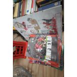 A Collection of Liverpool football programmes and a Liverpool tribute print.