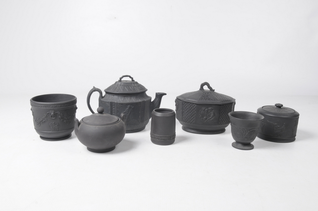 A collection of late 19th Century and later black basalt wares
Comprising a teapot and cover, the