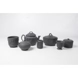 A collection of late 19th Century and later black basalt wares
Comprising a teapot and cover, the