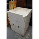 A substantial cast iron safe manufactured by J Grove,