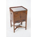 A George III inlaid mahogany wash-stand
With a raised three quarter gallery above a faux drawer