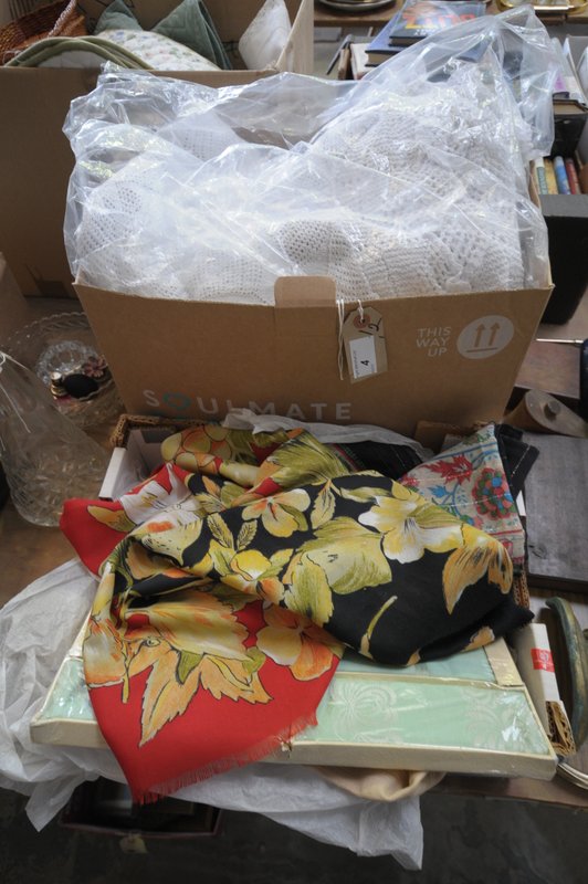 2 Boxes of linen, needlework table linen, doilies, crocheted throw, white sheets, scarves, etc.