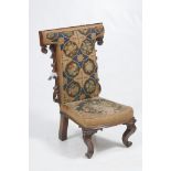 A William IV rosewood and Berlin work Prie-Dieu chair
With a cruciform padded tapestry back with