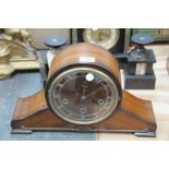 An Early 20th century Napoleon hat walnut cased mantel clock with a 3 train movement.