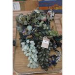 A Collection of decorative glass grapes and ornamental miniature trees.