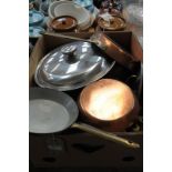 Copper pans and other assorted saucepans.