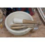 A Stone pestle and mortar and a pair of butter pats.