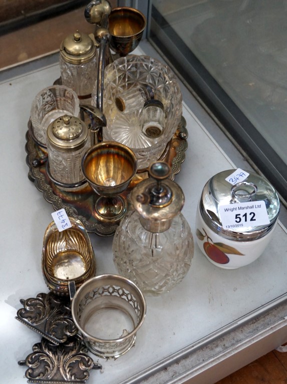 A mixed group of silver-plated items to include a cream jug, belt buckles,
