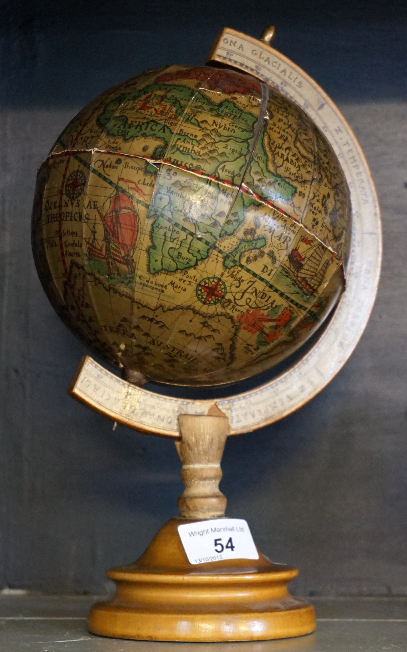 A modern terrestrial globe of small proportions.