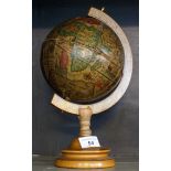 A modern terrestrial globe of small proportions.