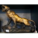 An Art Deco style plaster model of a Lion, painted in gilt,