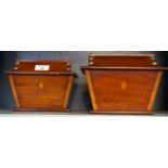 A pair of early 20th Century inlaid mahogany dome top tea caddies of rectangular form.