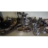 A quantity of assorted silver-plate to include tea services, candlesticks, trays, etc.