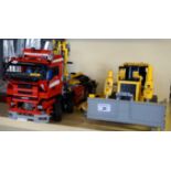 Two modern Lego vehicles to include a truck and bulldozer.